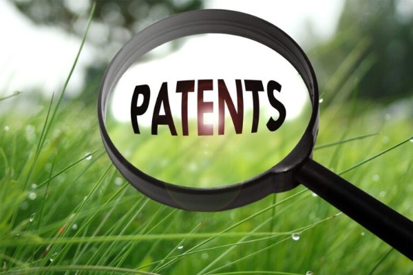 Analyst reviewing patent data, technology trends, and innovation maps to perform patent landscape analysis and competitive intelligence.