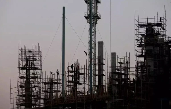Modern construction site featuring sustainable concrete, smart bricks, and innovative building materials used in eco-friendly construction projects.