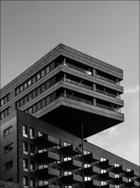 Modern building featuring sustainable glass facades and advanced metal structures, highlighting innovative construction materials and green building technology.